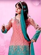 The very silhouette and styling of this outfit proves quiet flattering for most body types and renders a rather grand and majestic appeal. This well-designed kameez nicely designed with embroidery patch work. Embroidery is done with applique, beads and cotton lace work in form of floral motifs. Embroidery on kameez is highlighting the beauty of this suit. Matching dupatta and churidar come along with this suit. This beautiful party wear suit is made with chiffon fabric. Slight Color variations are possible due to differing screen and photograph resolutions.