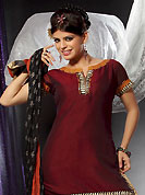 Ultimate collection of embroidered suits with fabulous style. This maroon readymade salwar kameez is embllished with beautiful embroidery patch work in fabulous style. Embroidery is done with resham, sequins and kasab work. Contrasting rust cotton salwar and black dupatta is available with this suit. This drape crafted with art silk fabric. Slight color variations are possible due to differing screen and photograph resolutions.