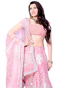 Get ready to sizzle all around you by sparkling lehenga. This pink net A-Line lehenga choli is nicely embroidered and patch work done with stone, sequins, beads and cutdana work in form of floral motifs. Beautiful hand embroidery work on lehenga is stunning. The beautiful embroidery on lehenga made it awesome and gives you stylish and attractive look to others. Matching faux georgette choli and net dupatta is availble with this lehenga. Slight Color variations are possible due to differing screen and photograph resolutions.