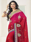 Create a style statement with soothing colors. This red saree is beautifully designed with extensive embroidered border and butti patch work. Embroidery is done with resham, zari and sequins work. This fabulous party wear saree is specially crafted for your stunning and gorgeous look. This beautiful drape is crafted with Crepe fabric. Matching blouse come along with this saree. Slight color variations are possible due to differing screen and photograph resolution.