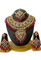 Go with this necklace set designed in a rhombus shaped frames which are nicely designed with diamonds and hanging crystal stones. A pair of matching earrings and beautiful maangtika embraces with this necklace. Keep away from water, sweat and perfume. Slight Color variations are possible due to differing screen and photograph resolution.