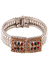 Deriving its inspiration from flow and continuity with this adorning bangle is studded with white, red, green and brown diamonds. This diamond base bangle is adjustable. Slight Color variations are possible due to differing screen and photograph resolution.