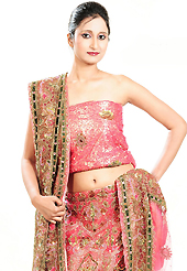 It’s cool and has a very modern look to impress all. This pink net lehenga is nicely embroidered patch work is done with cutdana, sequins, stone, beads and cutbeads work. The beautiful embroidery on lehenga made it awesome and gives you stylish and attractive look to others. Matching choli and dupatta is availble with this lehenga. Slight Color variations are possible due to differing screen and photograph resolutions.