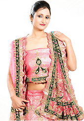 Outfit is a novel ways of getting yourself noticed. This pink net lehenga is nicely embroidered patch work is done with cutdana, sequins, stone, beads and cutbeads work. The beautiful embroidery on lehenga made it awesome and gives you stylish and attractive look to others. Matching choli and dupatta is availble with this lehenga. Slight Color variations are possible due to differing screen and photograph resolutions.