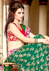 An occasion wear perfect is ready to rock you. This green net lehenga choli is nicely embroidered patch work is done with zari, gota patti and lace work. All over embroidery work on lehenga is stunning. The beautiful heavy embroidery on lehenga made it awesome and gives you stylish and attractive look to others. Contrasting red choli and green net dupatta is availble with this lehenga. Accessories shown in the image is just for photography purpose. Slight Color variations are possible due to differing screen and photograph resolutions.