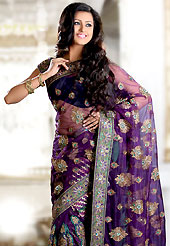 The popularity of this dress comes from the fact that it showcases the beauty modesty as well as exquisitely. This purple net saree is nicely designed with embroidered and silk patch work in fabulous style. Embroidery is done with self weaving, resham, zari, sequins, stone, kasab and cutdana work in form of floral motifs. Beautiful embroidery work on saree make attractive to impress all. This saree gives you a modern and different look in fabulous style. Matching blouse is available with this saree. Slight color variations are possible due to differing screen and photograph resolution.
