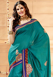 Breathtaking collection of sarees with stylish embroidery work and fabulous style. This teal green banarasi silk saree have beautiful embroidery patch work which is embellished with resham and zari work. Fabulous designed embroidery gives you an ethnic look and increasing your beauty. Matching blouse is available. Slight Color variations are possible due to differing screen and photograph resolutions.