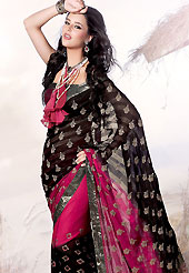 Welcome to the new era of Indian fashion wear. This black and magenta faux georgette saree is beautifully adorned with resham, zari, sequins and patch work in floral patterns. As shown blouse can be made possible and also can be customized as per your style subject to fabric limitation.  Slight color variations are possible due to differing screen and photograph resolution.